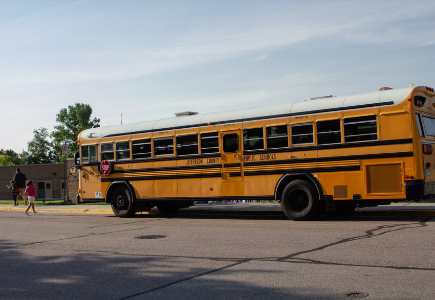 A Jeffco school bus drops students off at Rooney Valley Elementary Aug. 19 in Lakewood.